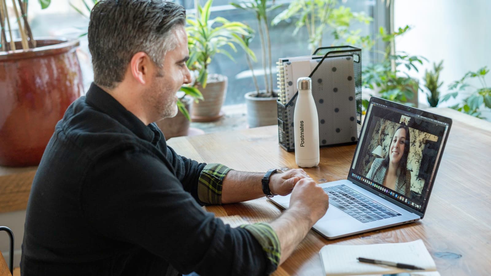 Someone at a desk taking a remote session on a laptop